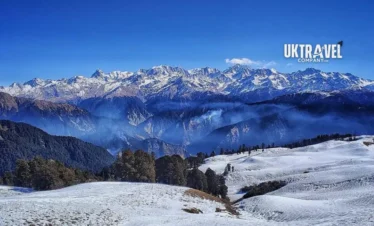 Dayara Bugyal Trek Package featured image showing snowy meadows and Himalayan mountain views in Uttarakhand.